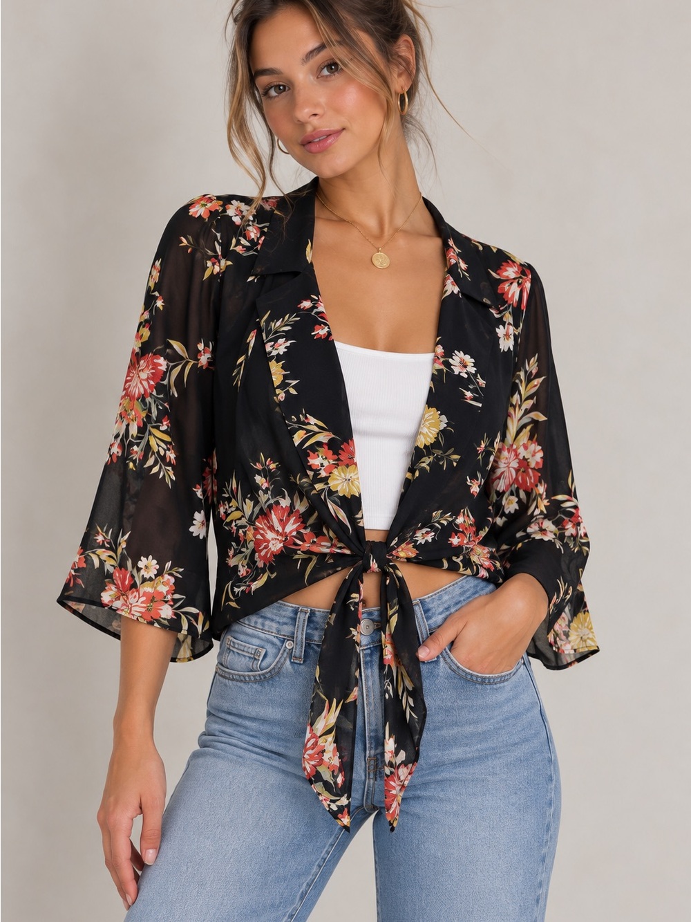Elle open from black floral blouse with tie